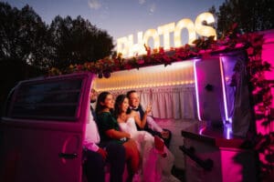 Party people making sill faces at the photo booth housed in Denver Photo Booth at a wedding